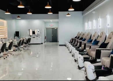 Modern, spacious interior of T & S Nails in Westfield, Indiana, US with luxurious pedicure chairs and manicure stations.