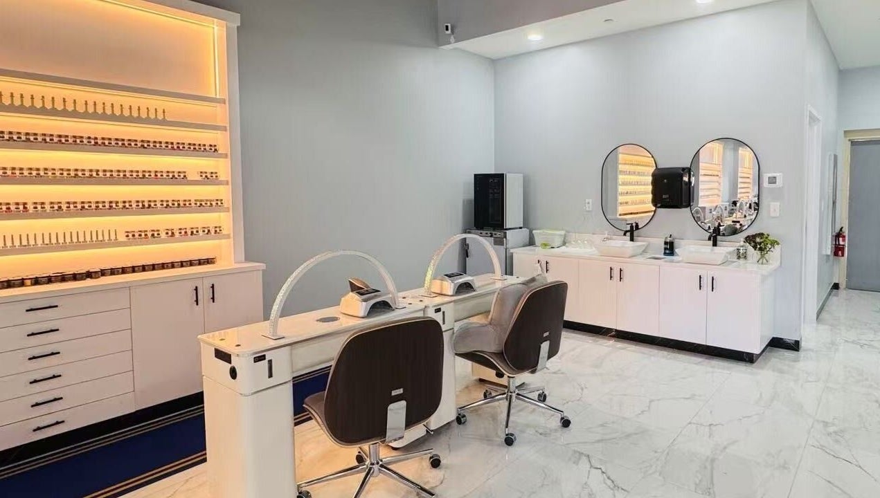 Modern nail salon setup at T & S Nails, Westfield, Indiana, US, showcasing sleek decor and manicure stations.