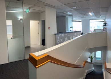 Contemporary interior of Viva Dentures, Auckland, NZ, showcasing sleek design and welcoming reception area.