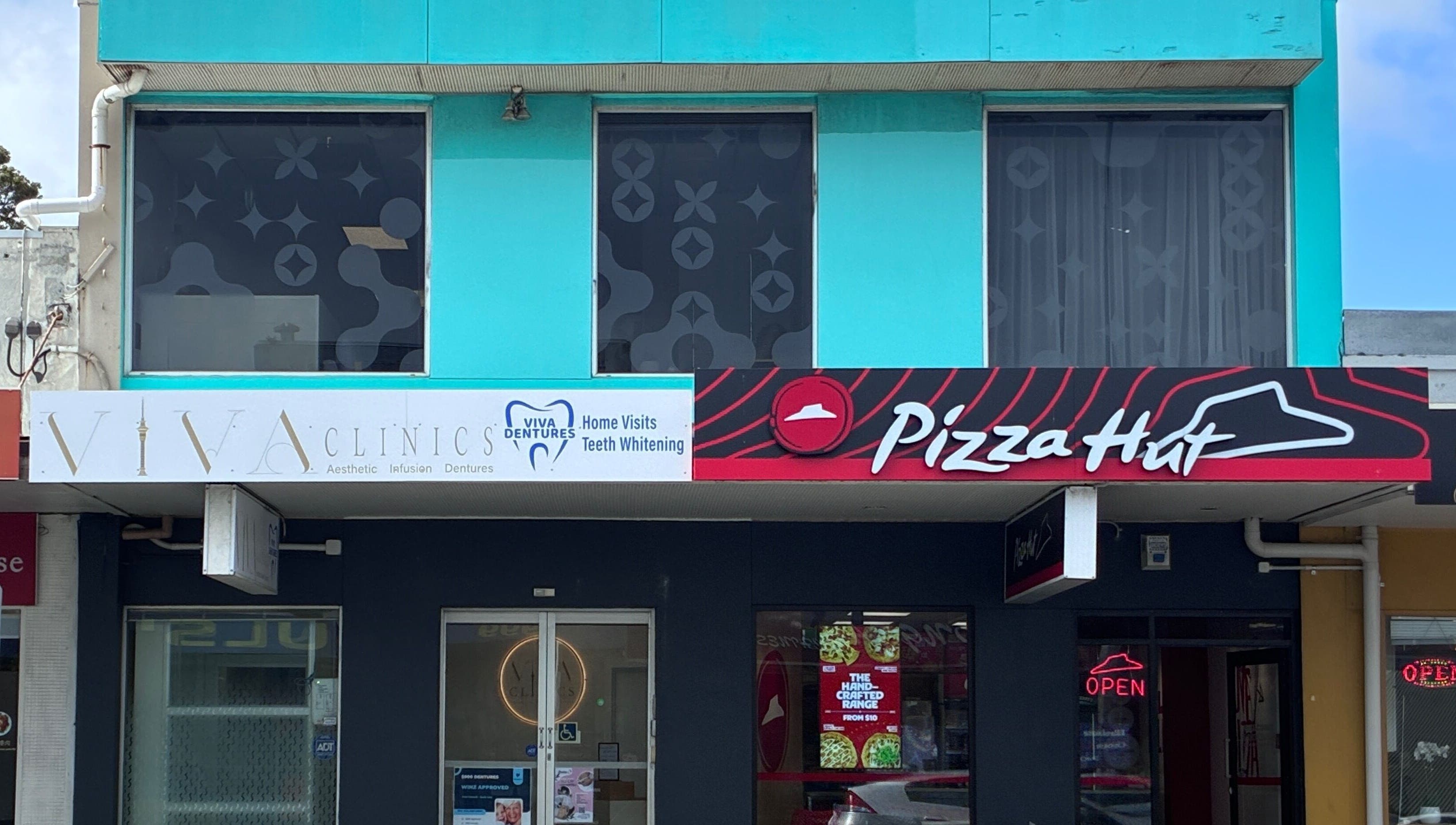 Viva Dentures storefront at Auckland, Auckland, NZ featuring modern blue facade.