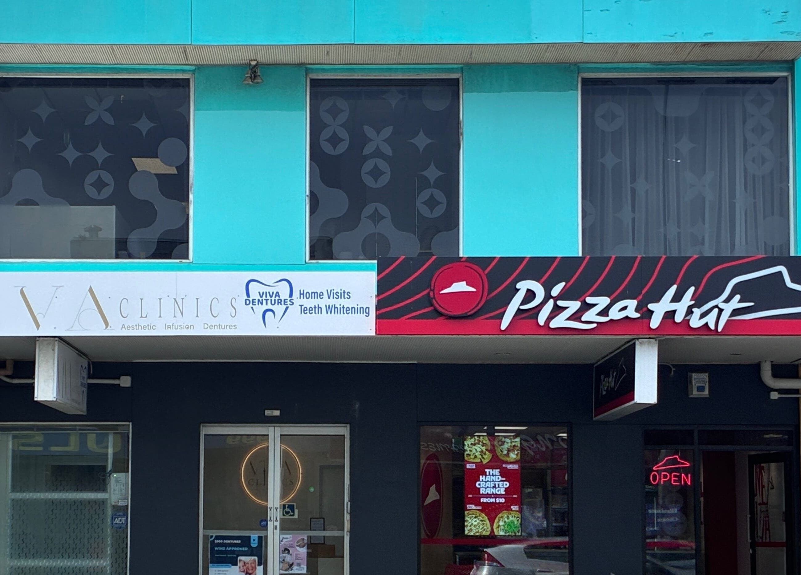 Viva Dentures storefront at Auckland, Auckland, NZ featuring modern blue facade.