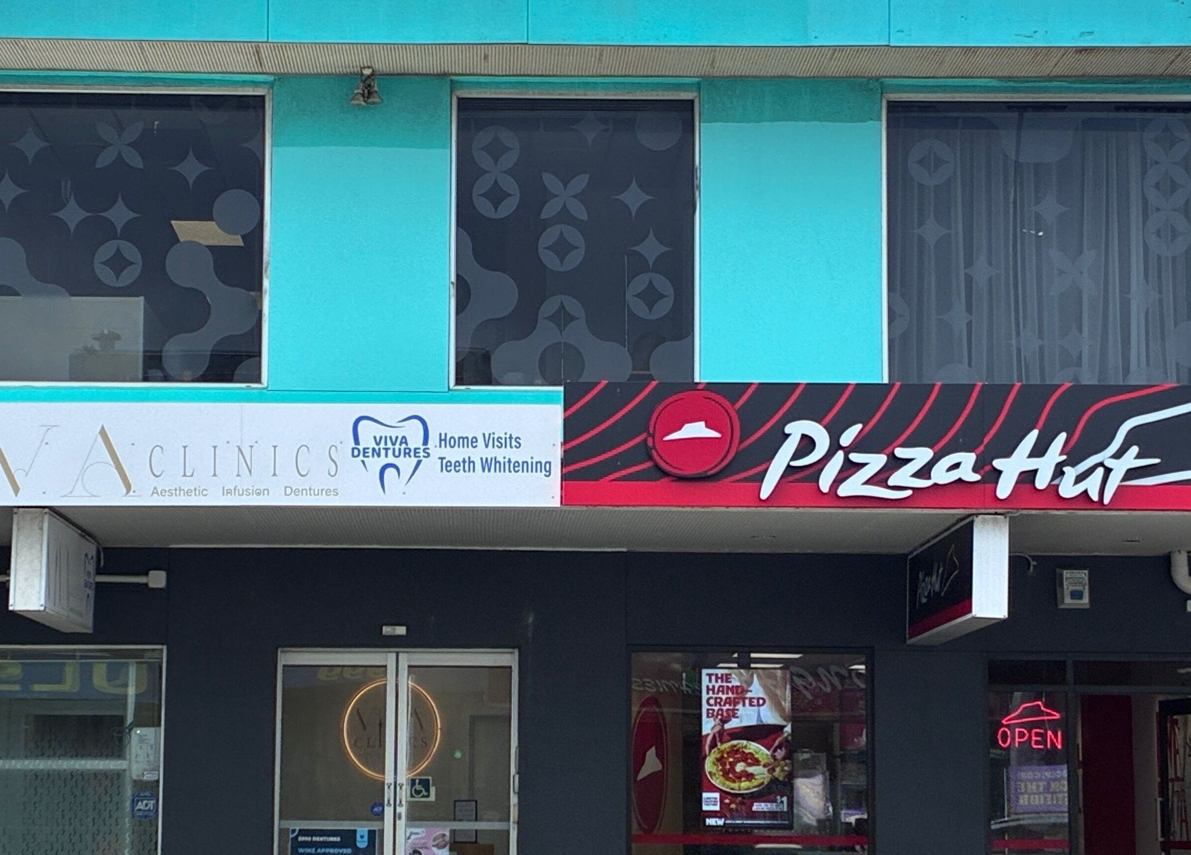 Viva Dentures clinic exterior in Auckland, Auckland, NZ next to Pizza Hut.