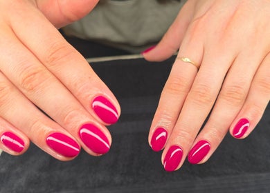 Freshly manicured hands with radiant pink polish at Beauty by Mollie, Brigg, England, GB.