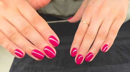 Freshly manicured hands with radiant pink polish at Beauty by Mollie, Brigg, England, GB.
