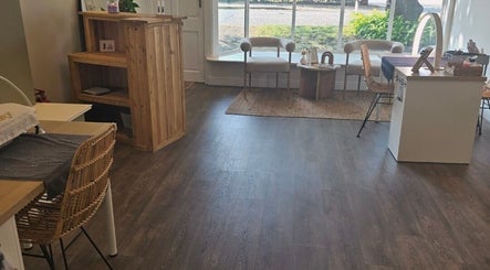 Inviting interior of Beauty by Mollie, Brigg, England, GB, showcasing warm decor and stylish seating.