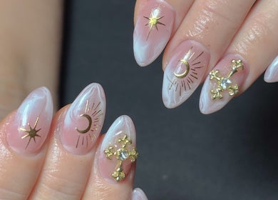 Elegant celestial nail art at DR Nails + Lash, Pasig, Metro Manila, PH showcasing gold moon and star designs.
