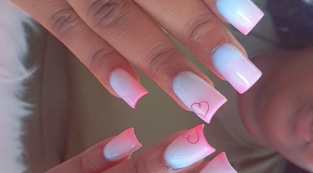 Elegant pink ombre nails with heart design at Sassy Tips by Sab, Spanish Town, St. Catherine Parish, JM.