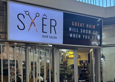 Entrance of Sker Hair Salon in Cape Town, Western Cape, ZA showcasing a stylish exterior design.