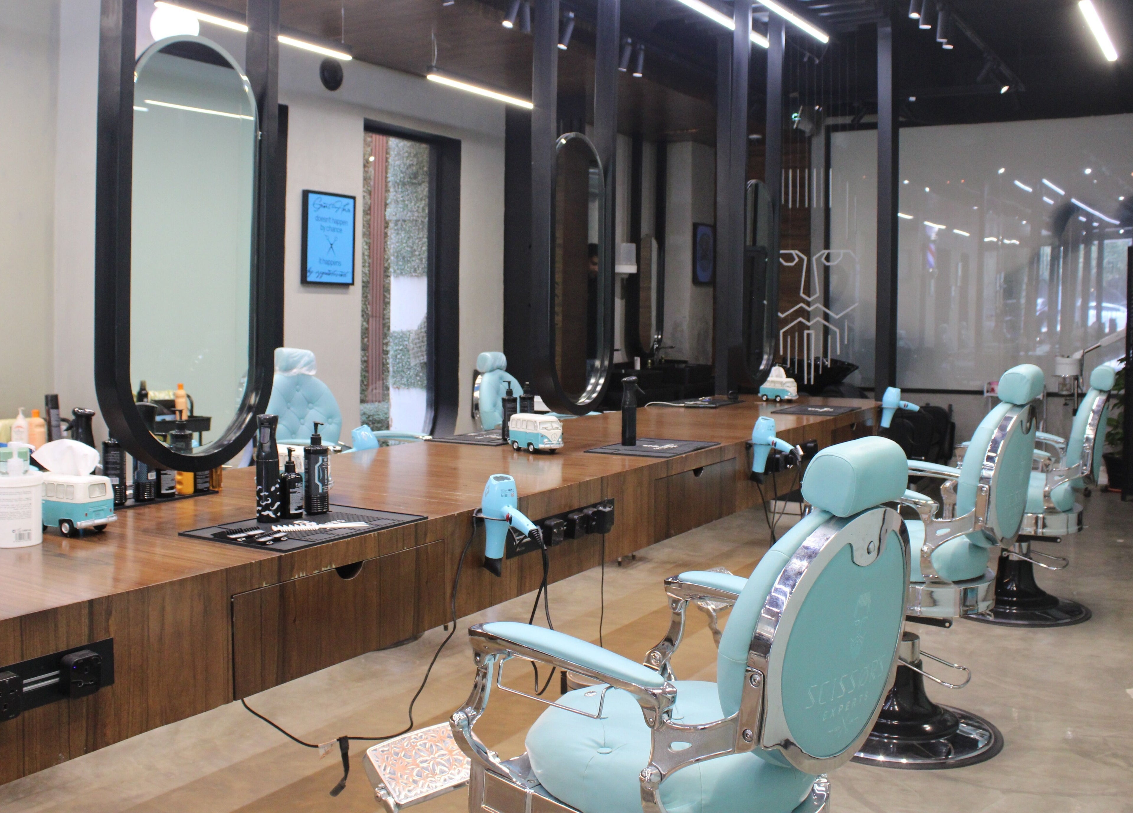 Modern barber chairs at Scissor's Experts Salon, Riyadh, SA, offering premium grooming services.