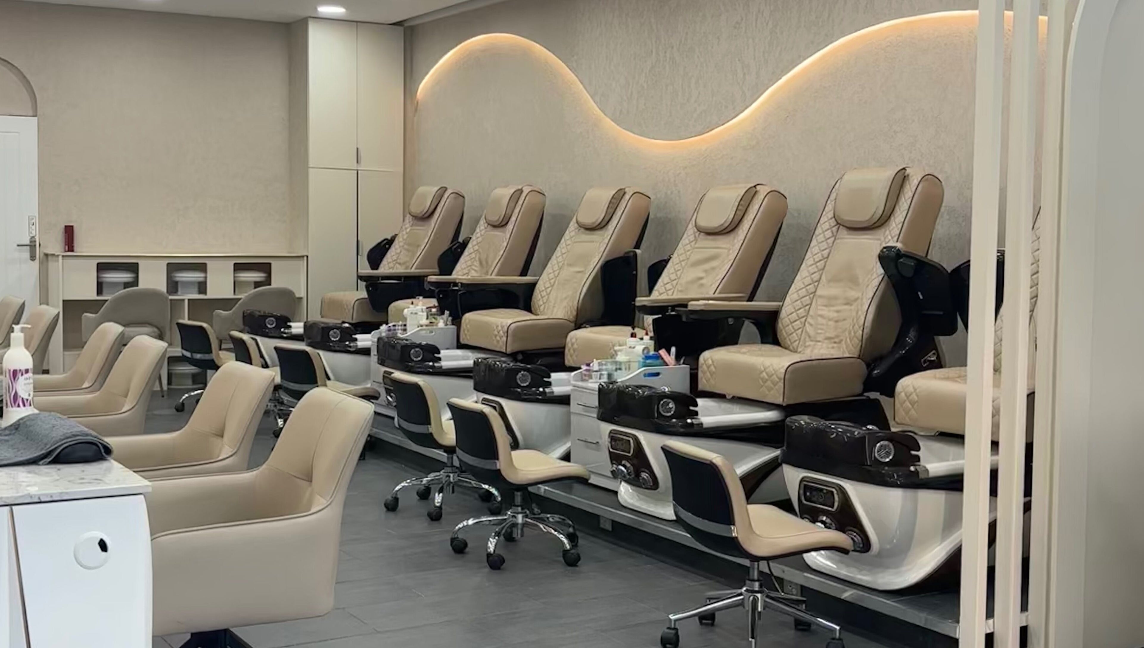 Elegant pedicure chairs at Go Glam, London, England, GB, showcasing plush comfort and style.