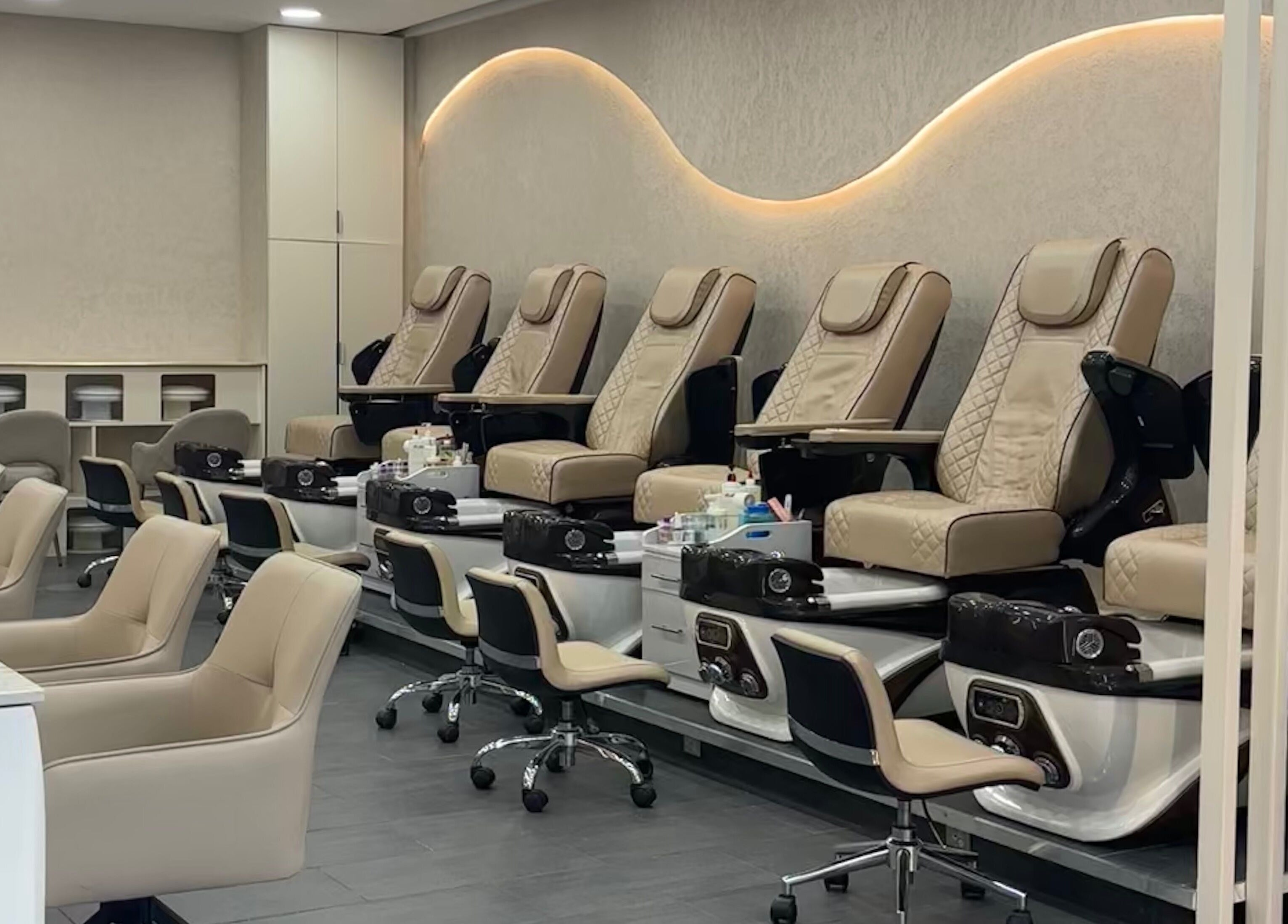 Elegant pedicure chairs at Go Glam, London, England, GB, showcasing plush comfort and style.