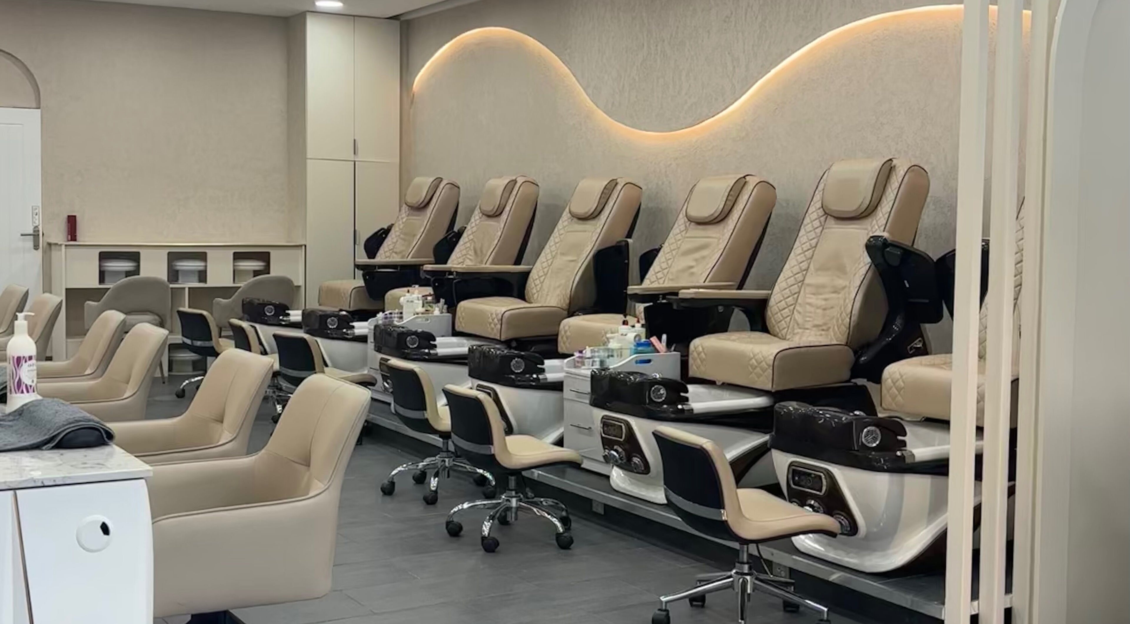 Elegant pedicure chairs at Go Glam, London, England, GB, showcasing plush comfort and style.