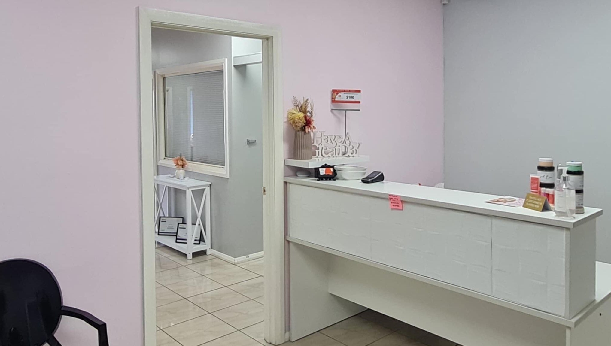 Reception area at Slimming Studio - Narellan, Narellan, New South Wales, AU, featuring a sleek desk and decor.