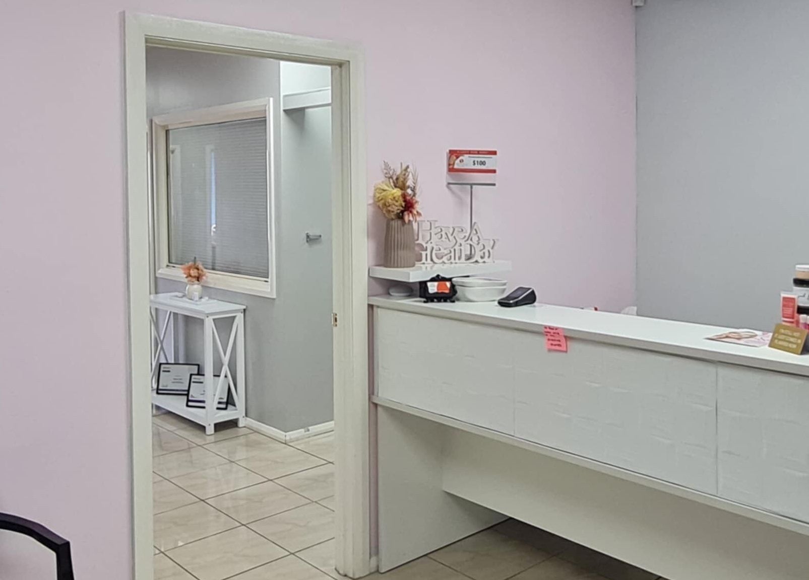Reception area at Slimming Studio - Narellan, Narellan, New South Wales, AU, featuring a sleek desk and decor.