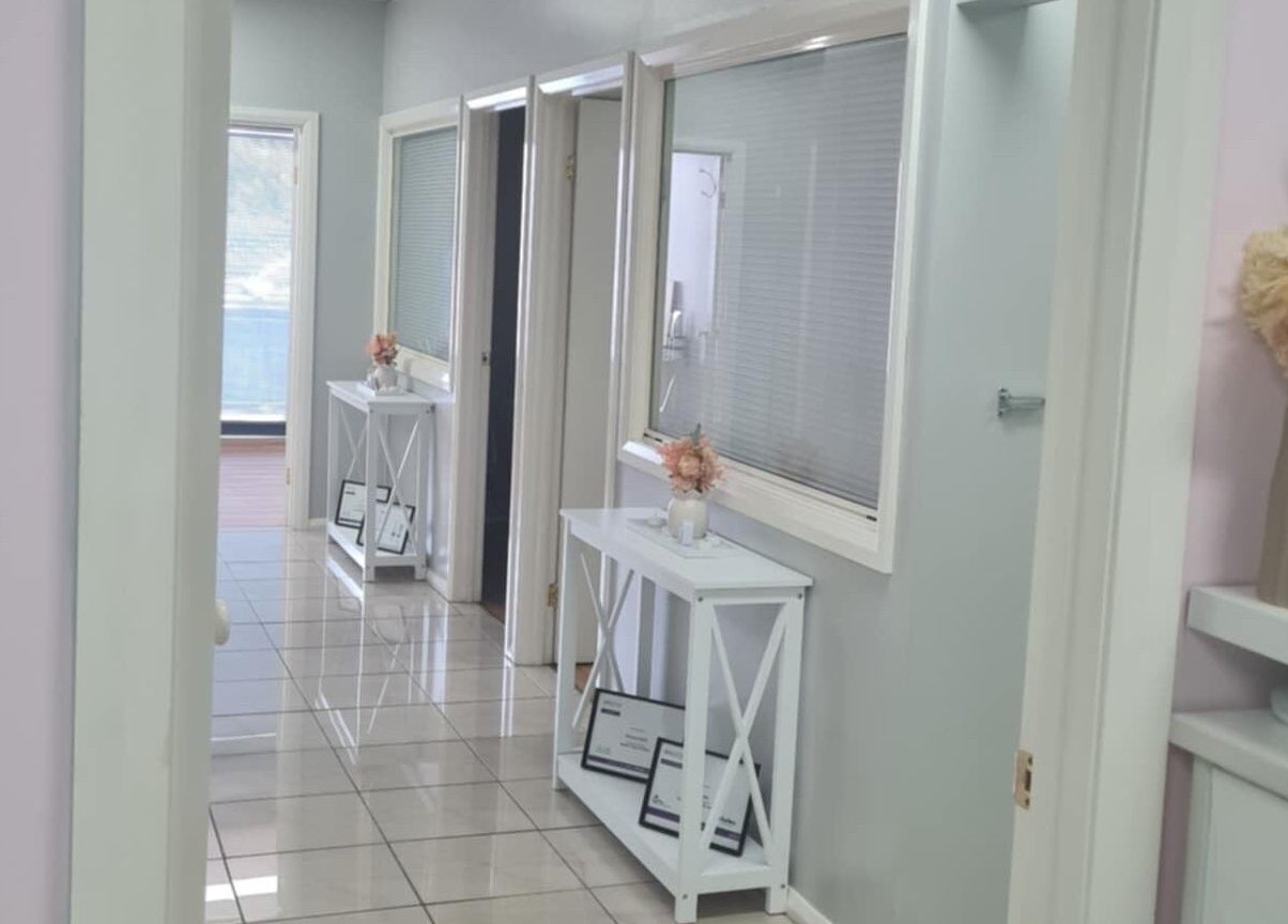 Bright hallway at Slimming Studio - Narellan, Narellan, New South Wales, AU with decor and certificates.