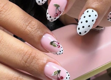 Elegant cherry nail art with polka dots at Nailful Salon, Jeddah, Makkah Province, SA.