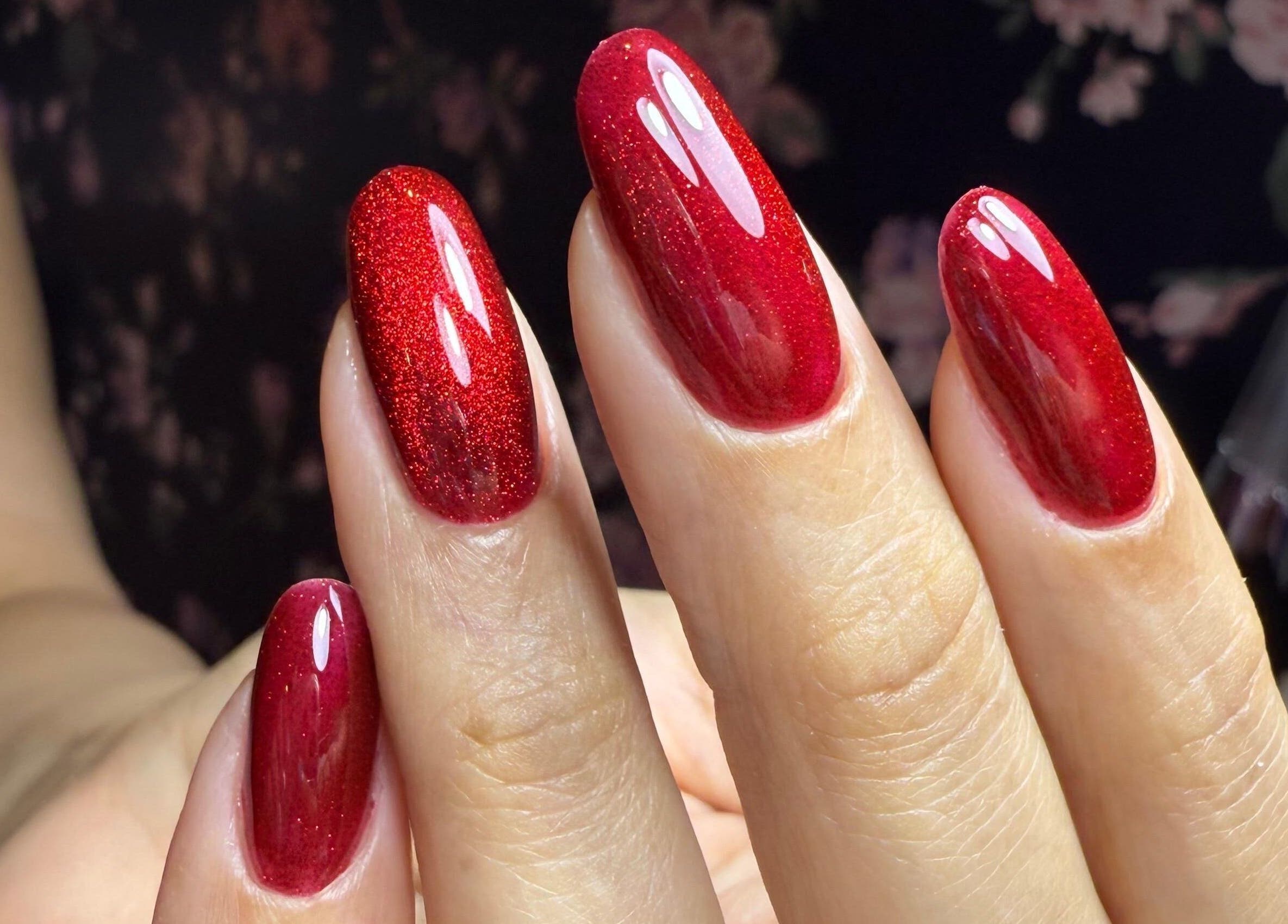 Vibrant red nails from Nailful Salon, Jeddah, Makkah Province, SA showcasing expert manicure.