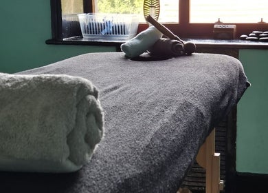 Cozy massage table at Relax Massage & Wellness in Darwen, England, GB, prepared with plush towels for a soothing session.
