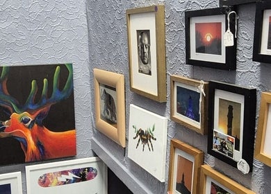 Colorful gallery wall at Relax Massage & Wellness, Darwen, England, GB showcasing vibrant art pieces.