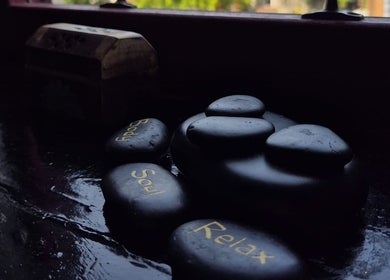 Smooth stones with 'Body', 'Soul', 'Relax' at Relax Massage & Wellness, Darwen, England, GB.