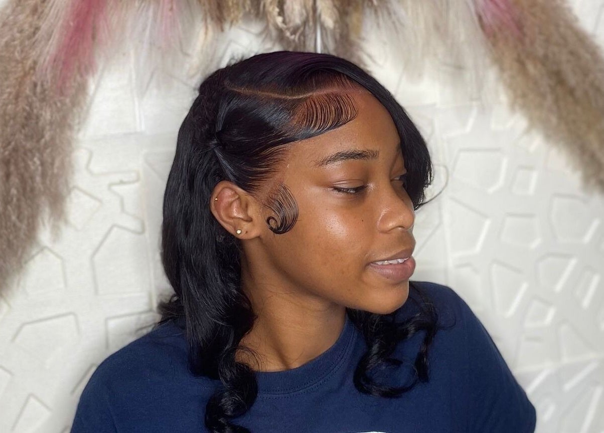 Woman with elegant hairstyle at Styles By Kera, Roseau, Saint George Parish, DM.