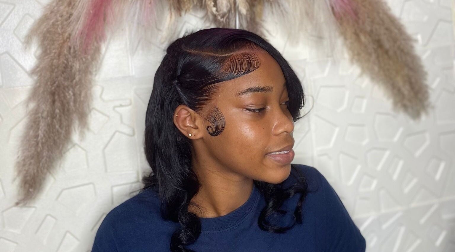 Woman with elegant hairstyle at Styles By Kera, Roseau, Saint George Parish, DM.