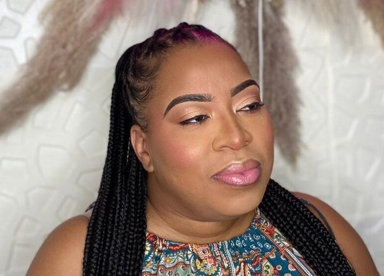 Woman with braided hair and makeup at Styles By Kera, Roseau, Saint George Parish, DM.