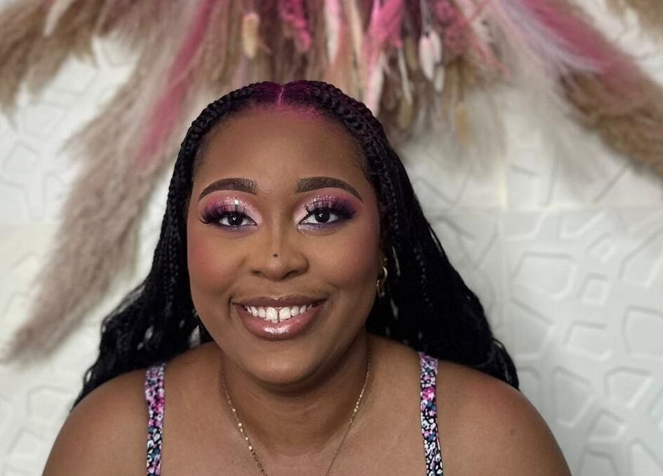 Radiant client smile with braided hairstyle at Styles By Kera, Roseau, Saint George Parish, DM.