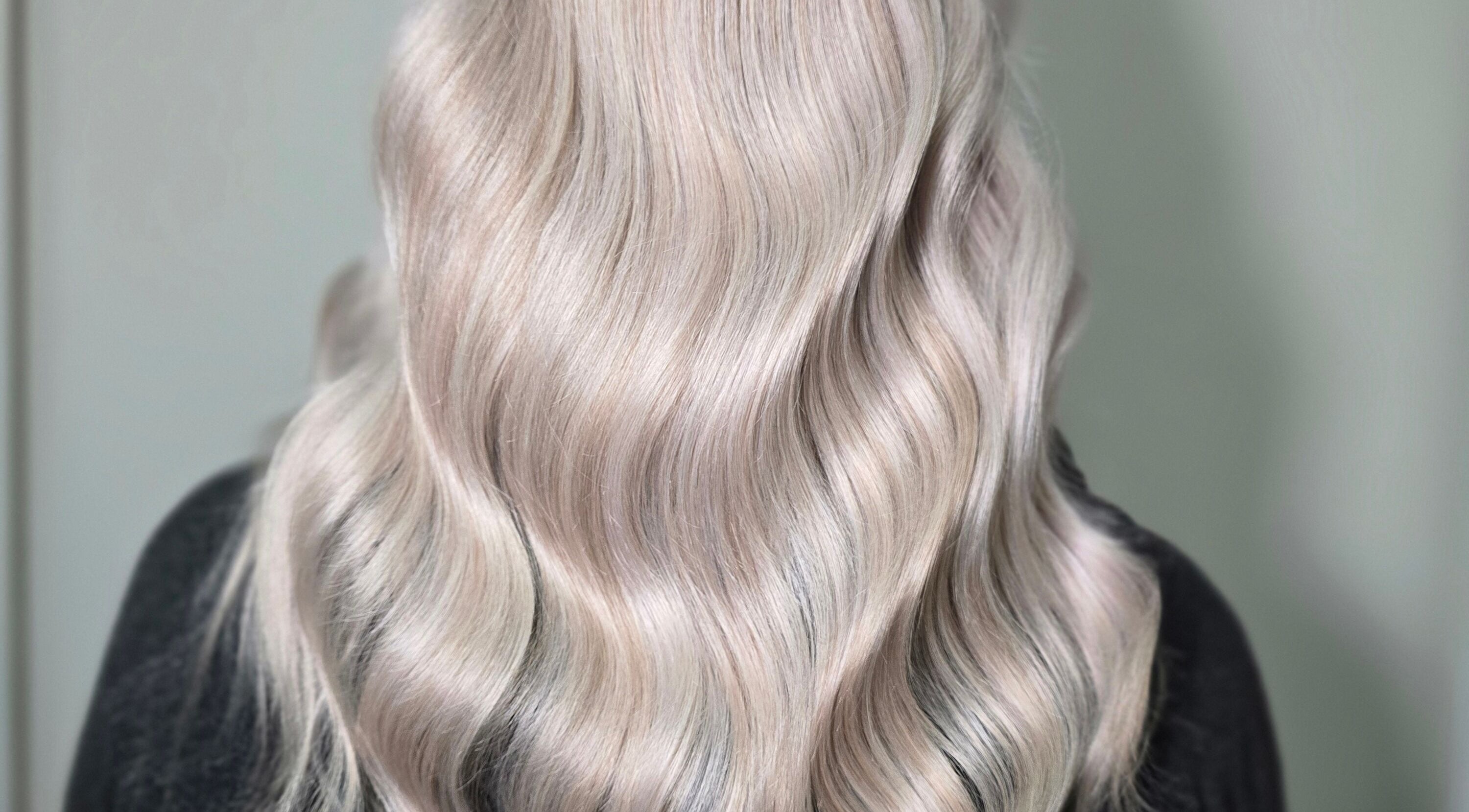 Luxurious blonde waves styled at Amor Luxe Hair, Clitheroe, England, GB. Perfect hairstyle for elegance.