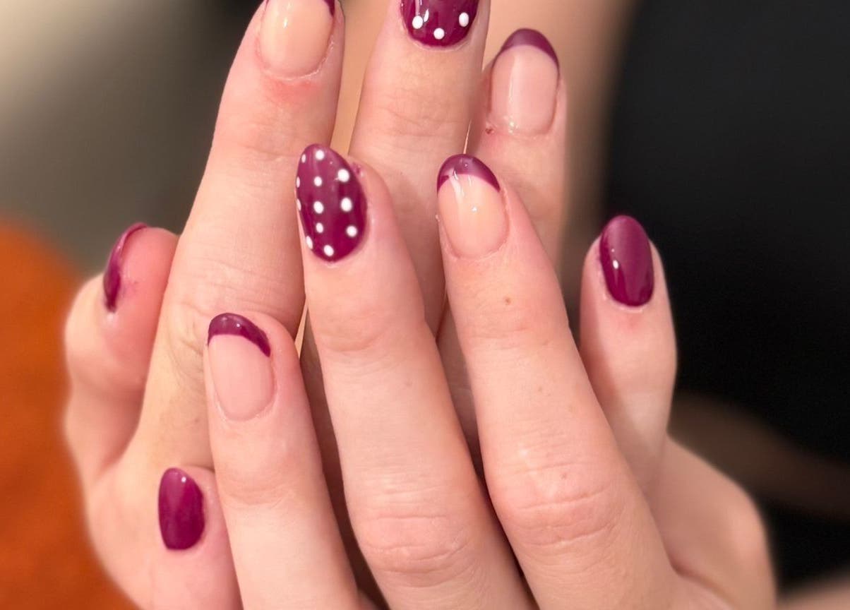 Stylish purple manicure with polka dots at Nails By El, Thurmaston, England, GB.