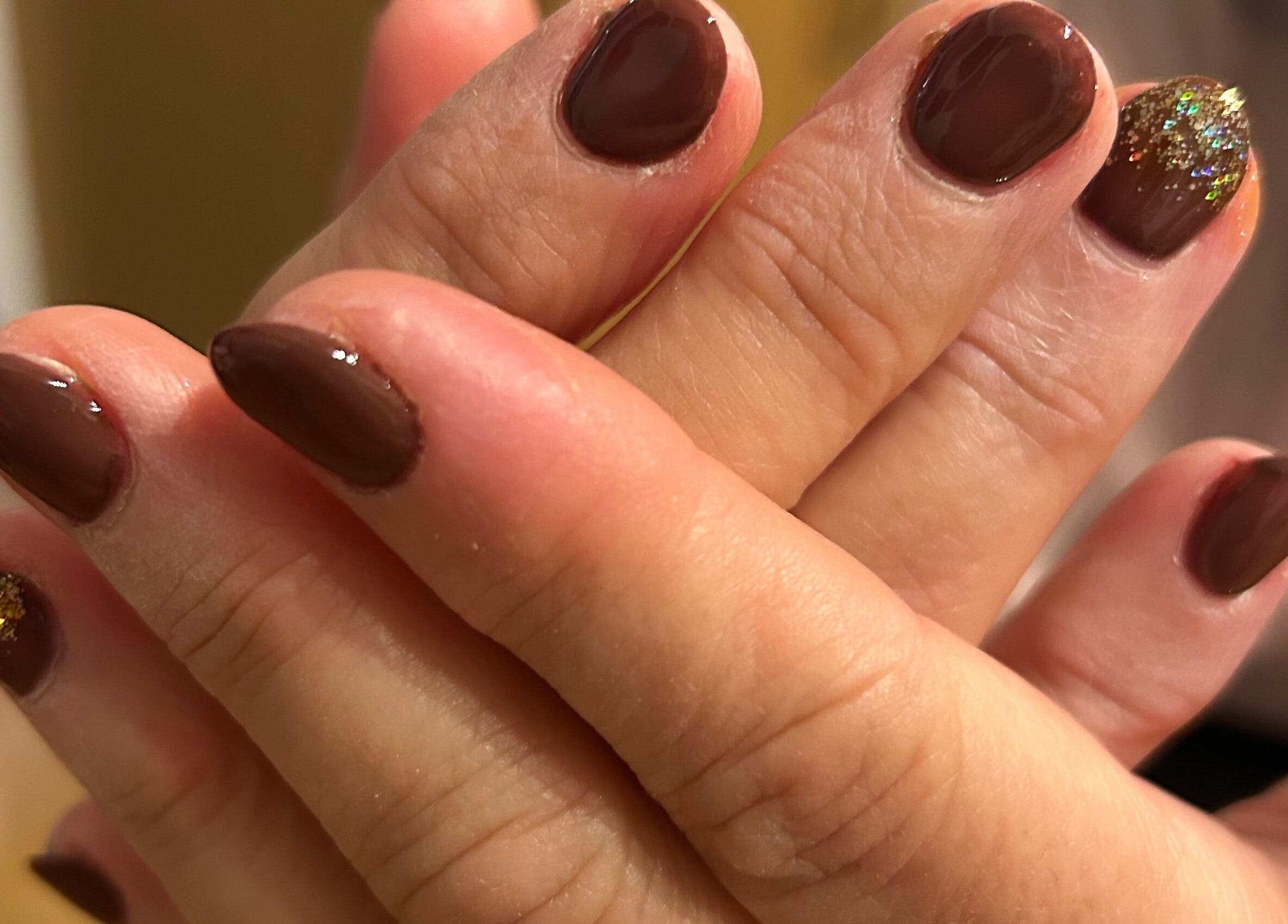 Elegant brown nails with glitter accent at Nails By El, Thurmaston, England, GB.
