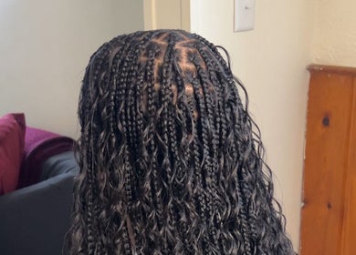 Intricate braided hairstyle at Mike The Stylist in Roseville, Michigan, US, showcasing expert craftsmanship.