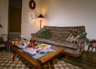 Cozy lounge area at Gelli Jam, Burswood, Western Australia, AU featuring plush sofa and decor.