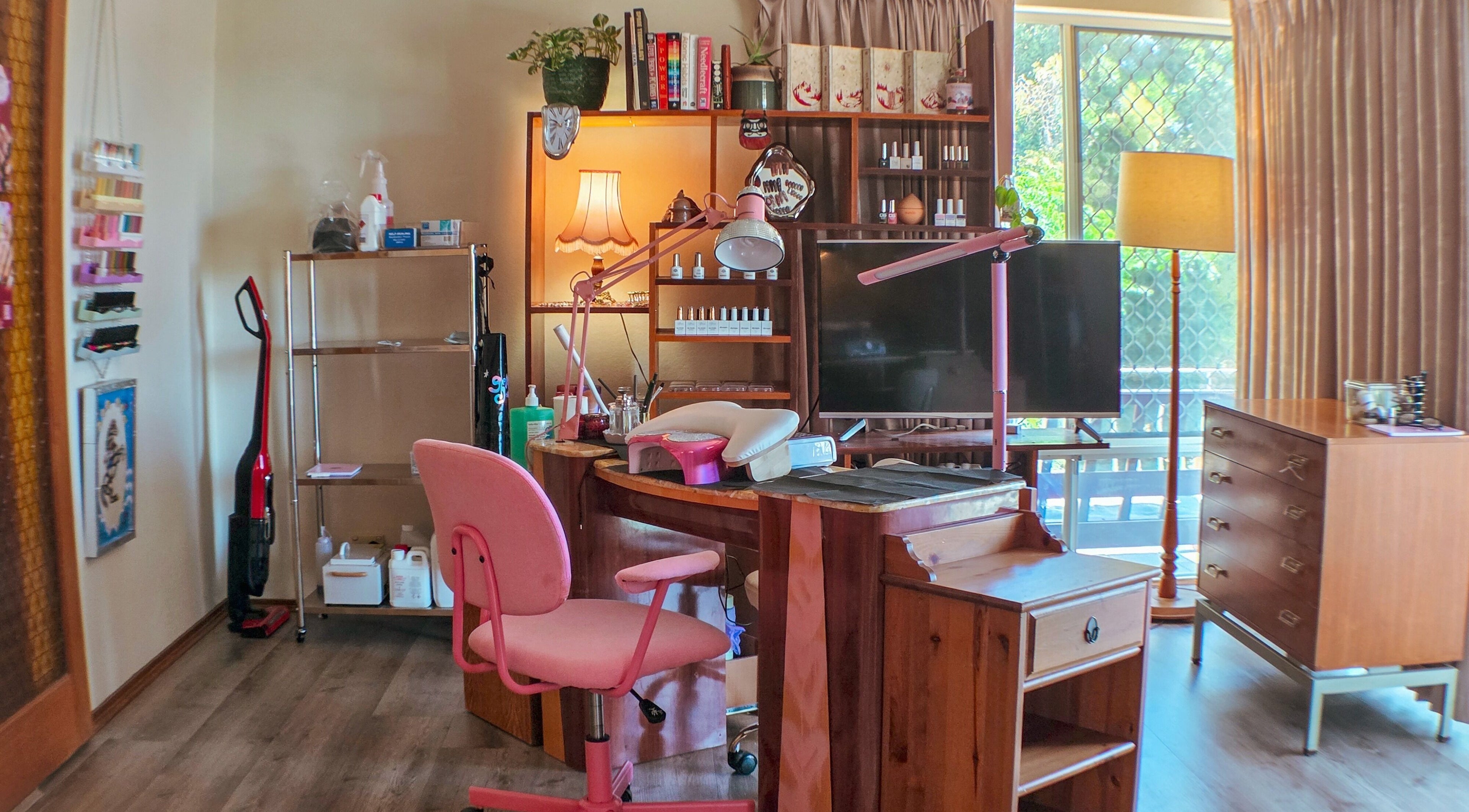 Cozy beauty workstation at Gelli Jam, Burswood, Western Australia, AU featuring pink chair and wooden decor.