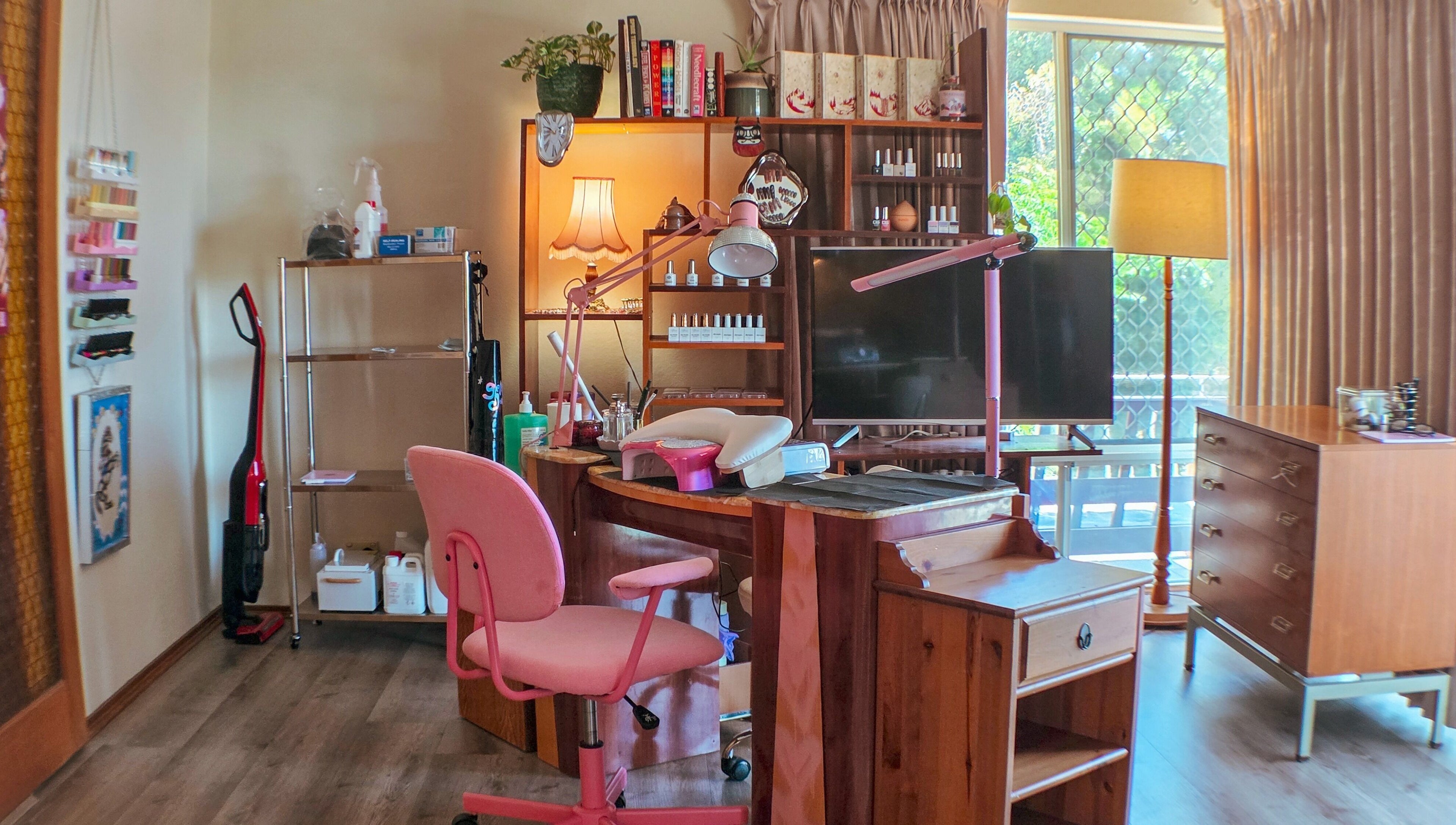Charming beauty setup at Gelli Jam in Burswood, Western Australia, AU with pink chair and wooden desk.
