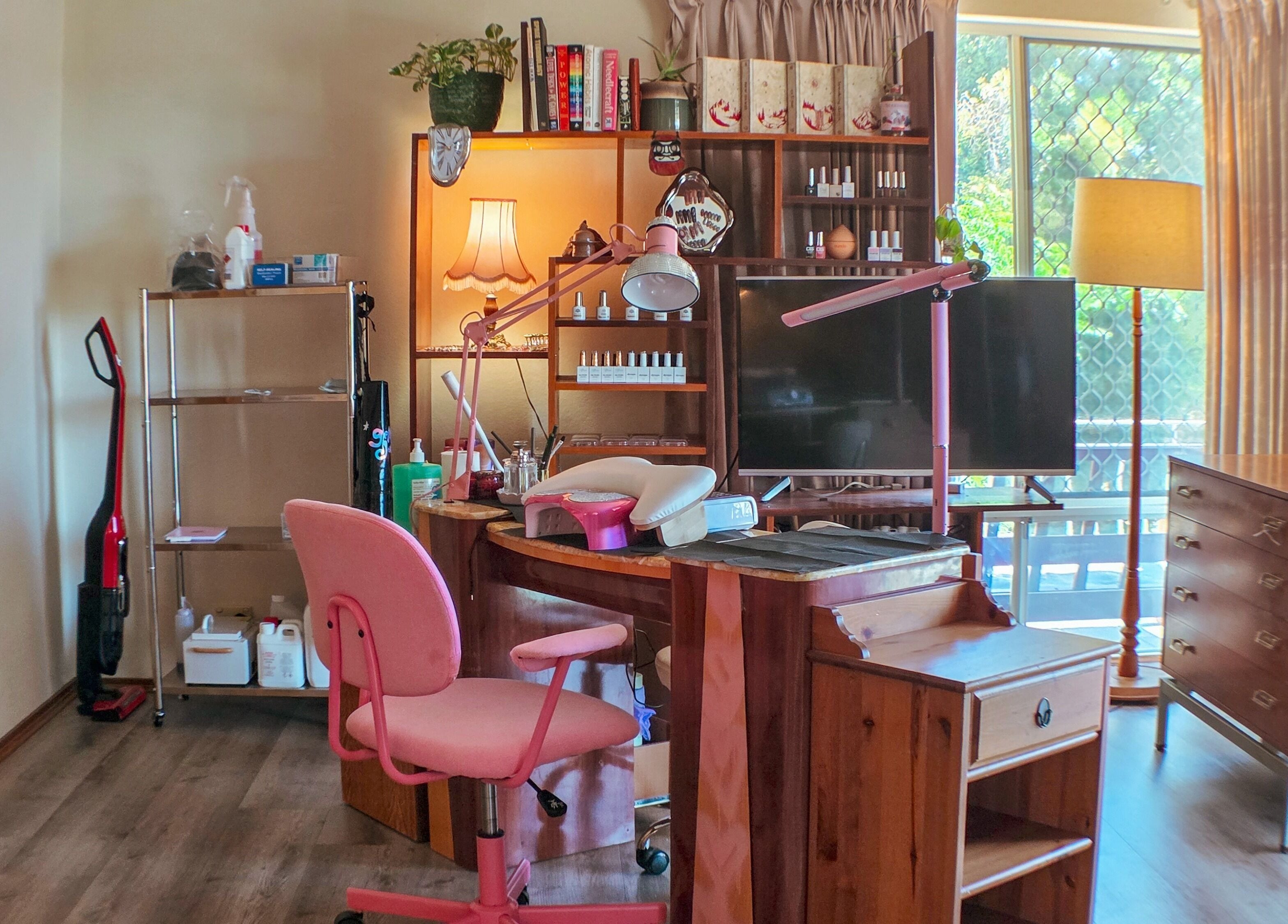 Charming beauty setup at Gelli Jam in Burswood, Western Australia, AU with pink chair and wooden desk.