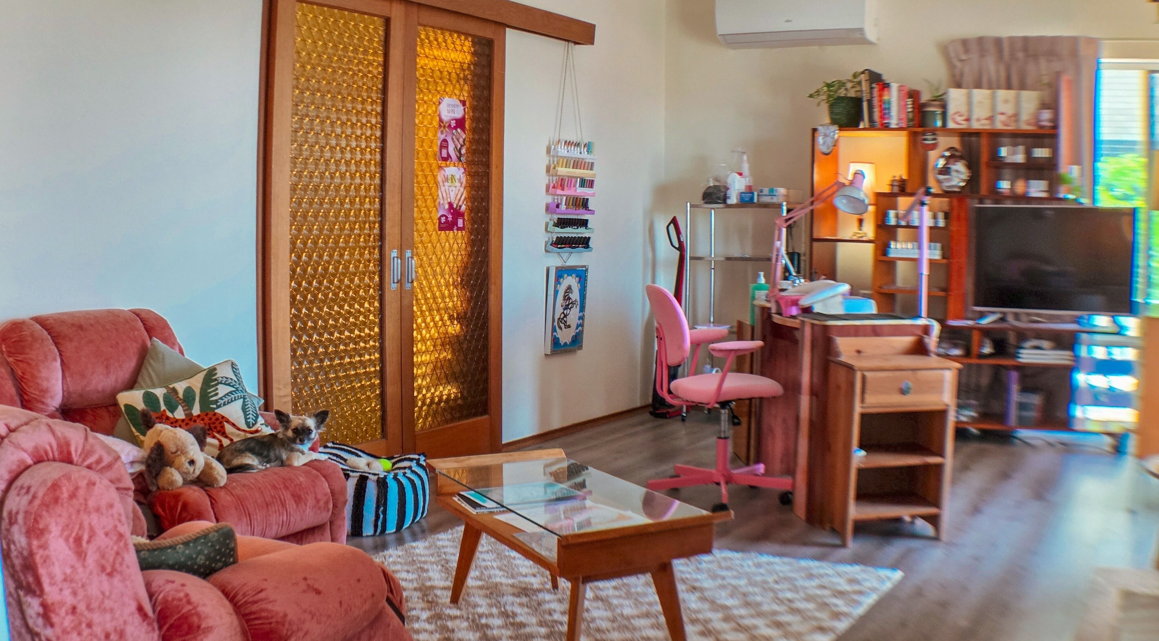 Relaxing beauty space at Gelli Jam in Burswood, Western Australia, AU with plush seating and nail polish display.