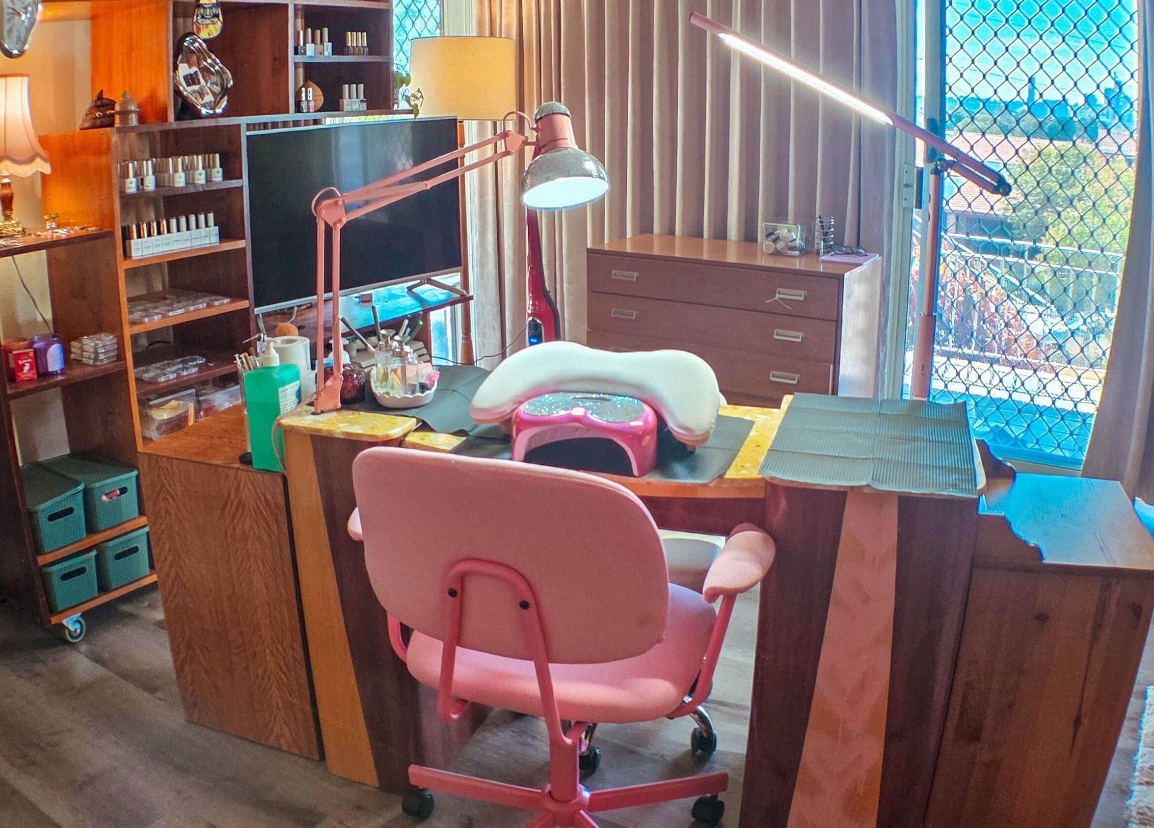 Cozy nail station at Gelli Jam, Burswood, Western Australia, AU, with pink chair and manicure supplies.