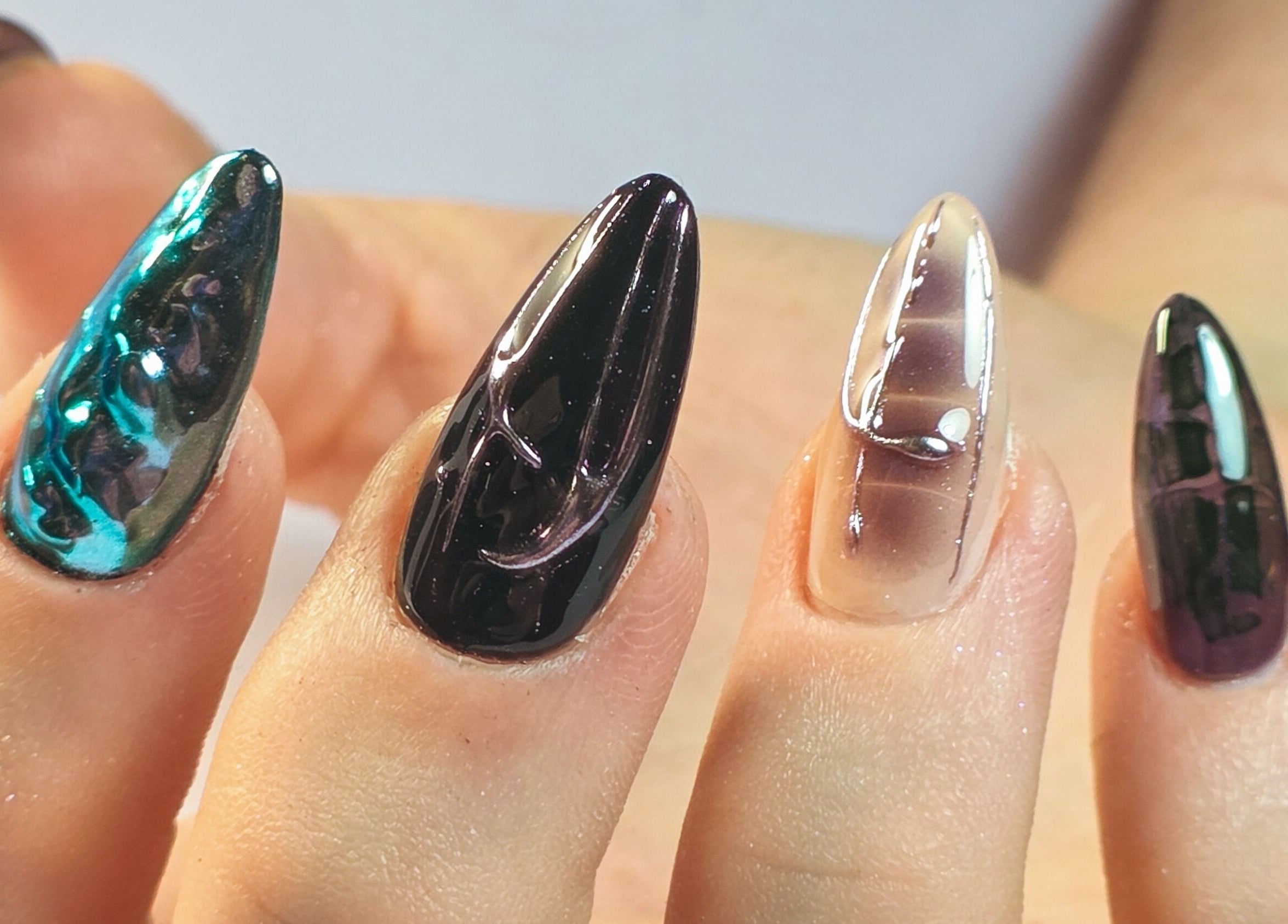 Stunning nail art at Gelli Jam, Burswood, Western Australia, AU with shiny multi-color designs.