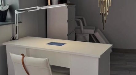 Modern workspace at Hellhouse Salon, Norwich, England, GB. Minimalist design with white desk and chair.