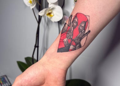 Close-up of a superhero tattoo design at Hellhouse salon in Norwich, England, GB.