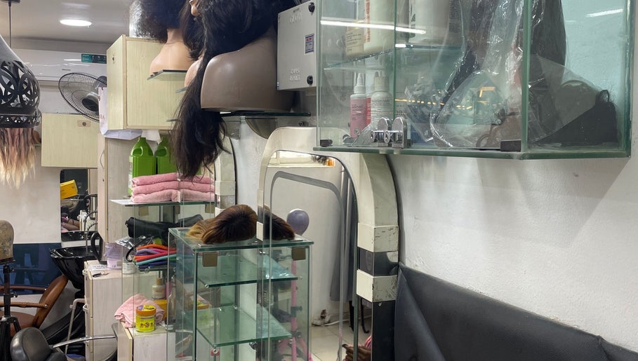 Interior of HairByTreapotter salon in Lagos, Lagos, NG, showcasing hair tools and products on display.