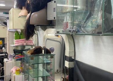 Interior of HairByTreapotter salon in Lagos, Lagos, NG, showcasing hair tools and products on display.