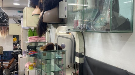 Interior of HairByTreapotter salon in Lagos, Lagos, NG, showcasing hair tools and products on display.