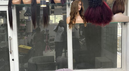 Stylish wigs on display at HairByTreapotter, Lagos, Lagos, NG, showcasing diverse hairstyling options.