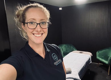 Therapist in massage room at Essential Remedial Massage, DoTheWorkHQ, Walton Summit Centre, Bamber Bridge, England, GB.