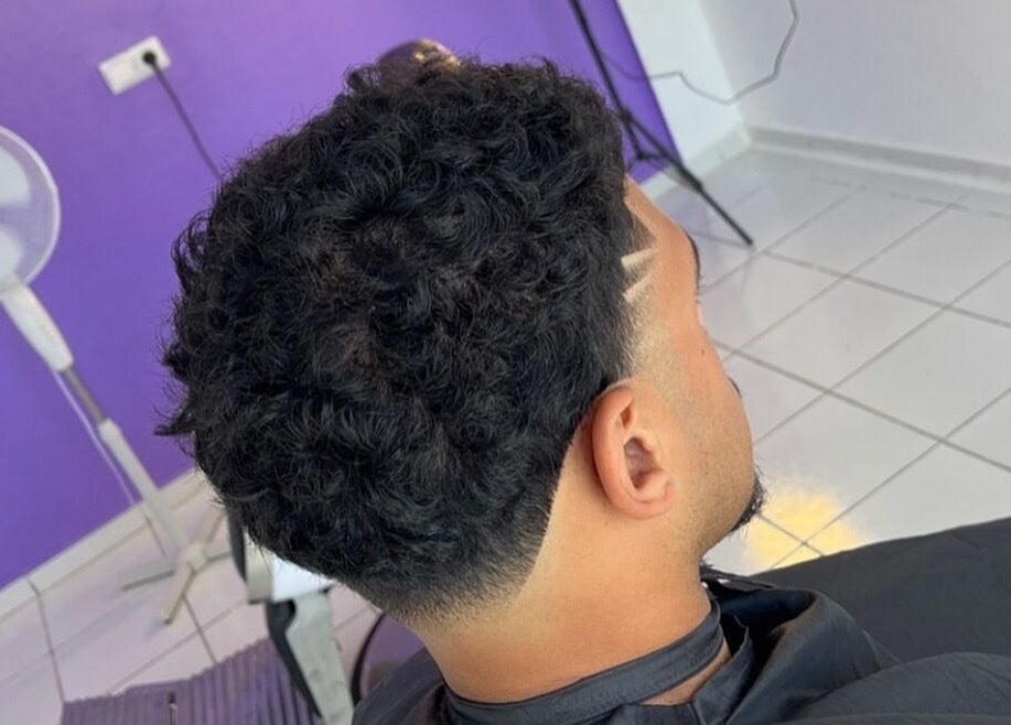 Stylish curly fade haircut at Mustafa Cuts, Sala Al Jadida, Rabat-salé-kénitra, MA.