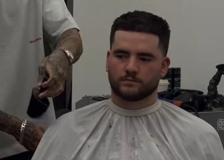 Barber at Mustafa Cuts in Sala Al Jadida, Rabat-salé-kénitra, MA, crafting a stylish fade for a client.