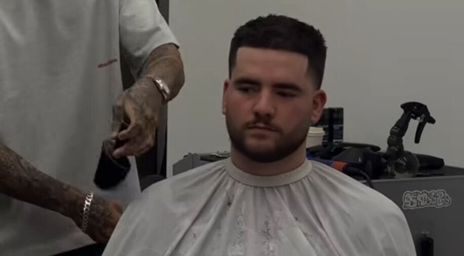 Barber at Mustafa Cuts in Sala Al Jadida, Rabat-salé-kénitra, MA, crafting a stylish fade for a client.