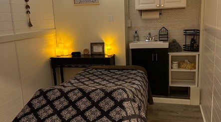 Calming wellness room at Soul Craft Coaching & Wellness, Lapeer, Michigan, US with massage bed and soothing lights.